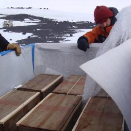 2013-14 AHT team unloading artefacts from cubers, Cape Evans (003)