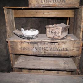 2013-14 Location image, stacked biscuit boxes, Scott's 'Discovery' hut, Hut Point