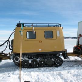 2013-14 Hägglunds travelling over a crack in the sea-ice (002)