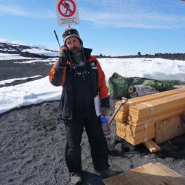 2009-10 AHT's Gord Macdonald on satellite phone at Cape Evans