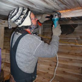 2009-10 AHT's Gord Macdonald working inside Stables, Scott's 'Terra Nova' hut