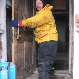 2005-06 Paul Terry rehanging the door of Shackleton's 'Nimrod' hut, Cape Royds