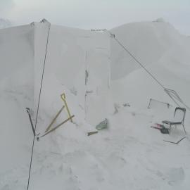 Snow build-up at field camp site, Cape Royds