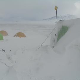 Snow build-up at field camp site, Cape Royds 