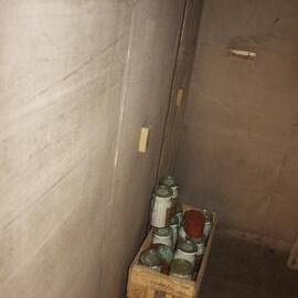 2012 Shackleton's 'Nimrod' hut interior, crate of salt jars in Shackleton's room