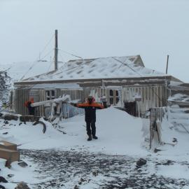2010-11 Jamie Clarke outside Shackleton's 'Nimrod' hut, Cape Royds