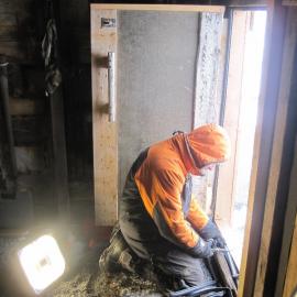 2010-11 Conservators at work, Jaime Ward working at Scott's 'Terra Nova' hut