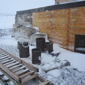 2010-11 Fodder bales and artefacts outside Scott's 'Terra Nova' hut