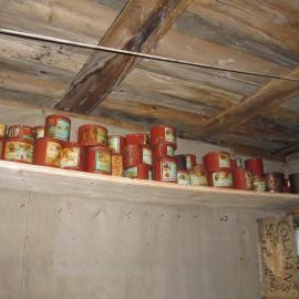 2010-11 Tinned provisions on a shelf inside Shackleton's 'Nimrod' hut