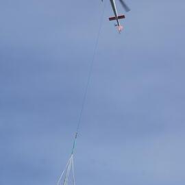 2022-23 Helicopter delivering artefacts and equipment, Cape Royds