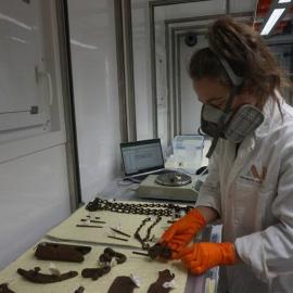 2022 Conservators at work, Shannah Rhynard-Geil weighing artefacts