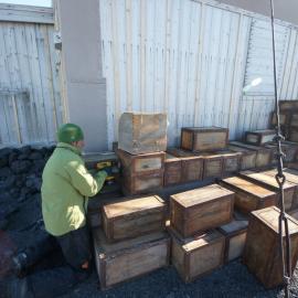 Reinstalling Venesta cases, Shackleton's 'Nimrod' hut 