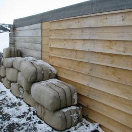 2010-11 Fodder bales stacked outside the Stables, Cape Evans