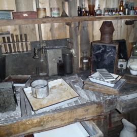 2010-11 Photographic supplies on the shelves within the Darkroom, Cape Evans