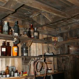 2010-11 Photographic supplies on the shelves within the Darkroom, Cape Evans