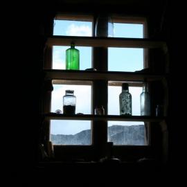 2010-11 Bottles in a window of Shackleton's 'Nimrod' hut, Cape Royds
