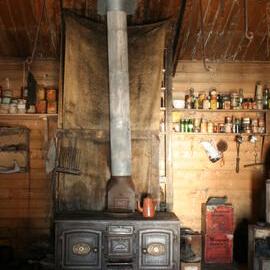 2010-11 Mrs Sam Stove inside Shackleton's 'Nimrod' hut, Cape Royds