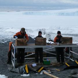 2010-11 AHT Staff treating bulkhead boxes, Cape Evans