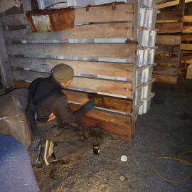 2010-11 Jaime Ward staining wood in the Cape Evans Stables