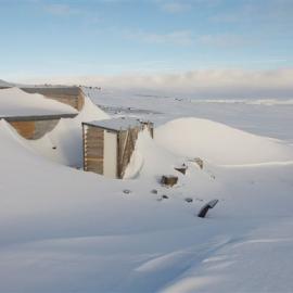 Snow build-up, north and latrine of Scott's 'Terra Nova' hut