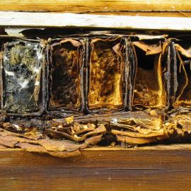 Box containing baking powder tins