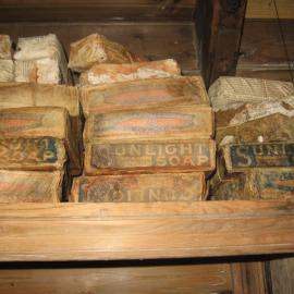 2010-11 Stack of Sunlight soaps inside Shackleton's 'Nimrod' hut, Cape Royds