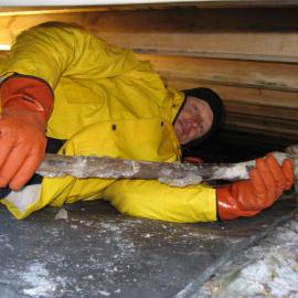2010-11 John Taylor underneath Shackleton's 'Nimrod' hut, Cape Royds