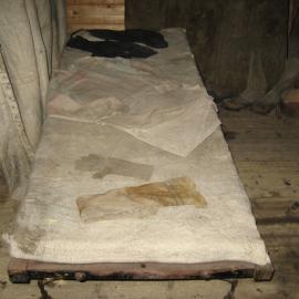 2010-11 Garments on a bunk inside Shackleton's 'Nimrod' hut, Cape Royds