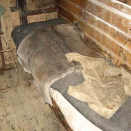 2010-11 Garments on a bunk inside Shackleton's 'Nimrod' hut, Cape Royds