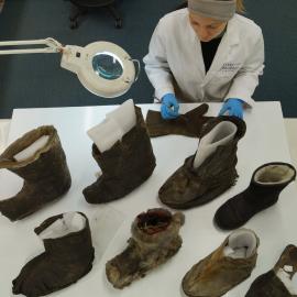 2014 AHT's Stefanie White with clothing artefacts in winter conservation lab, Scott Base (002)