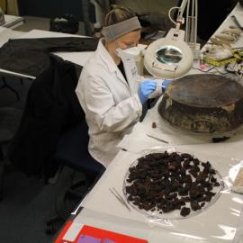 2014 AHT winter conservators at work - Stefanie White treating pan with seal meat (002)