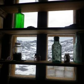 2014 Shackleton's 'Nimrod' hut interior, glass bottles at North facing window