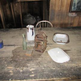 2015-16 Artefacts on Wardroom table, Scott's 'Terra Nova' hut