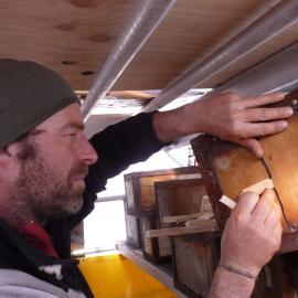 2010-11 Jaime Ward repairing a Venesta case, Cape Royds