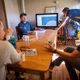 The South Pole Inspiring Explorers Expedition™ team looks over the route to be taken