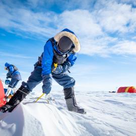 Mike Dawson pitching a tent on the South Pole Expedition