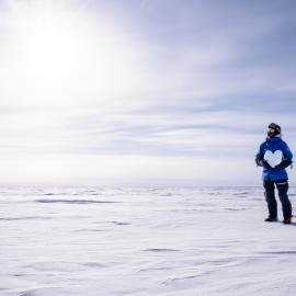 Marthe Brendefur with an ice heart on the South Pole Expedition