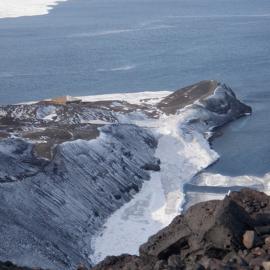 Scott's 'Discovery' hut and Vince's Cross at the end of Hut Point