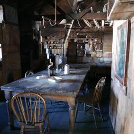 2018-19 Wardroom table inside Scott's 'Terra Nova' hut, Cape Evans