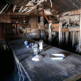 2018-19 Wardroom table inside Scott's 'Terra Nova' hut, Cape Evans