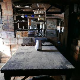 2018-19 Mess Deck table inside Scott's 'Terra Nova' hut, Cape Evans