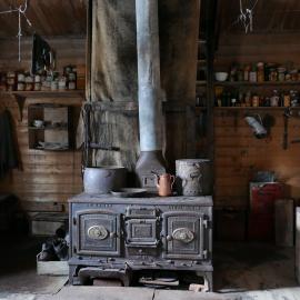 2018-19 Mrs Sam stove inside Shackleton's 'Nimrod' hut, Cape Royds