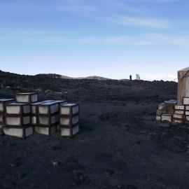 2018-19 Venesta cases stacked outside Shackleton's 'Nimrod' hut, Cape Royds