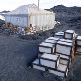 2018-19 Venesta cases stacked outside Shackleton's 'Nimrod' hut, Cape Royds