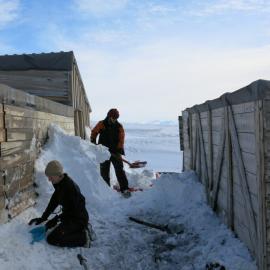 2013-14 Nicola Dunn and Josiah Wagener moving snow, Scott's 'Terra Nova' hut, Cape Evans