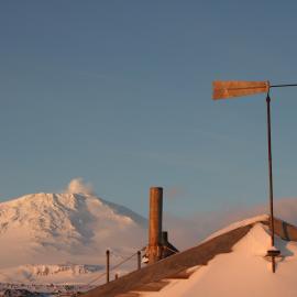Wind vane on Scott's 'Terra Nova' hut and Mount Erebus