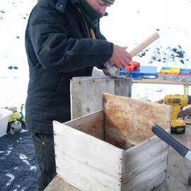 Heritage Carpenter Bryce Lewis repairing boxes from stables wall (001)
