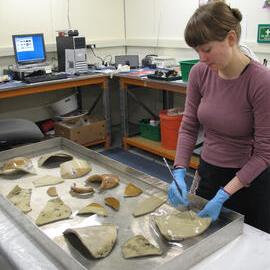 AHT Conservator Carla Pike washing ceramics