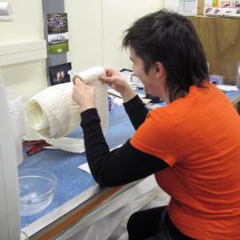 AHT Conservator Lizzie Meek treating chart paper roll