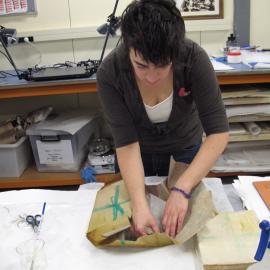AHT Conservator Lizzie Meek treating Aurora Australis paper